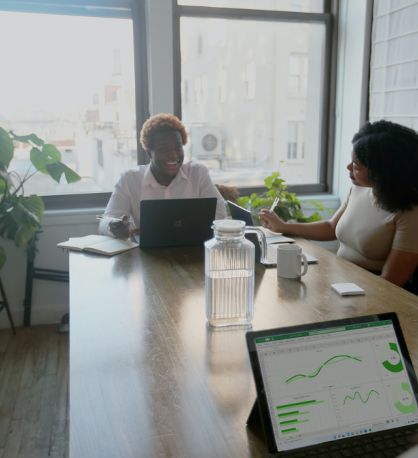 People seated at a table in a meeting room